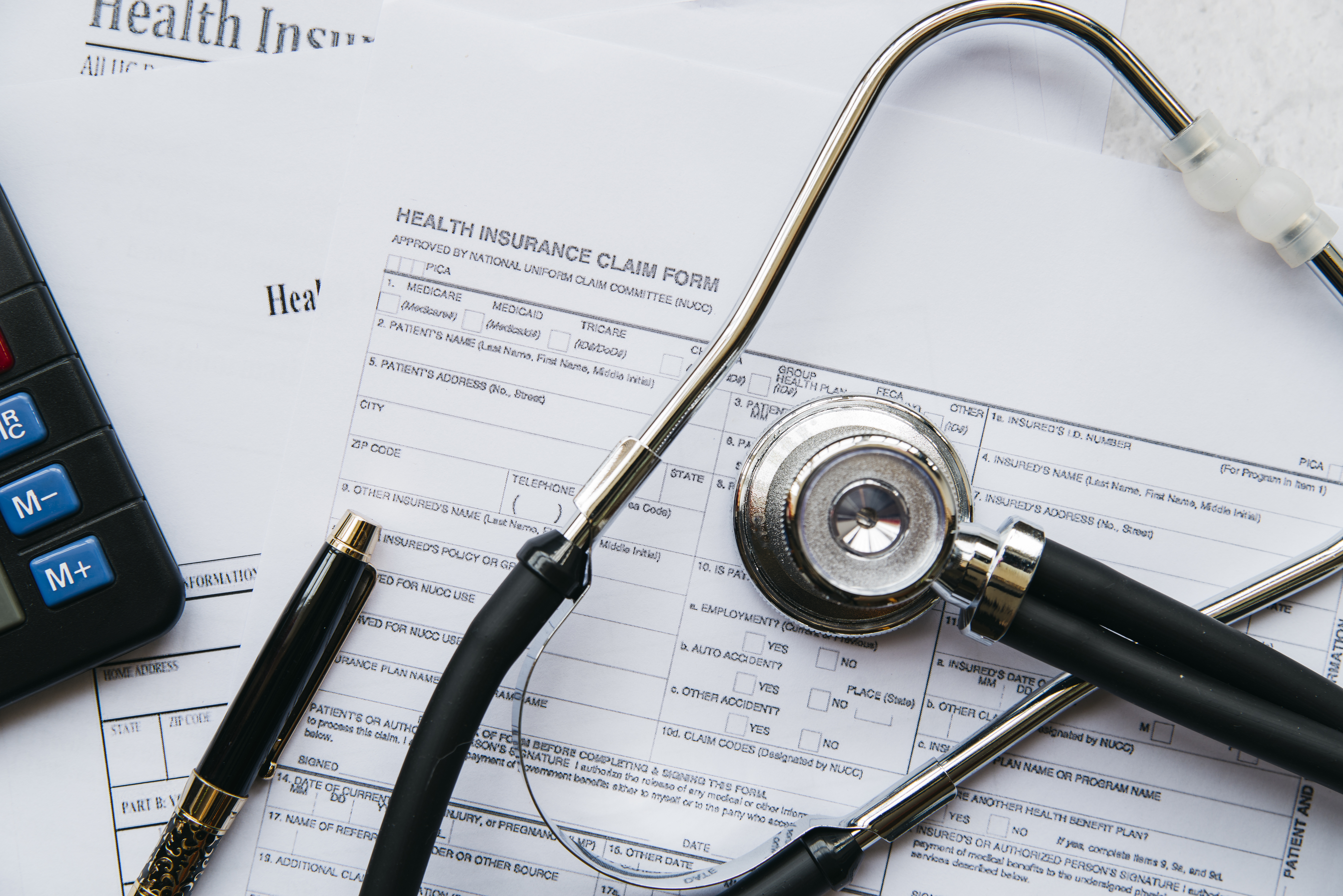 Medical stethoscope on legal documents